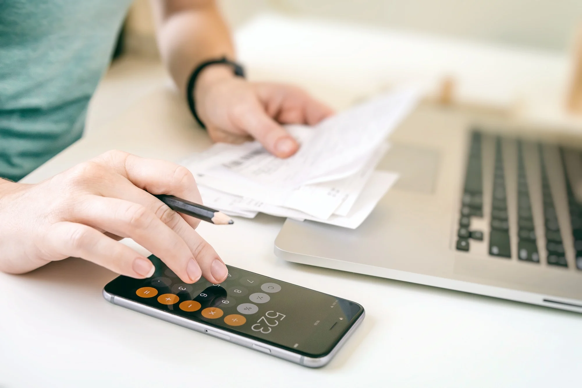 Woman making audit of household spendings at home